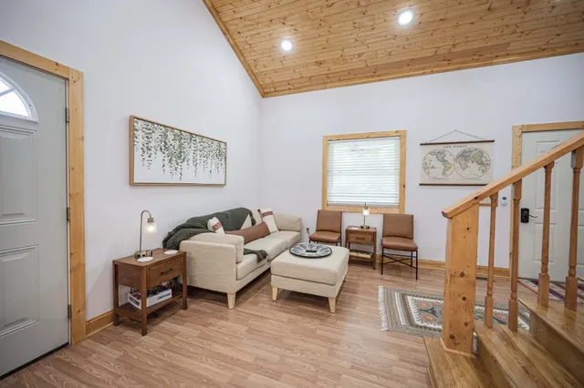a living room with furniture and a table