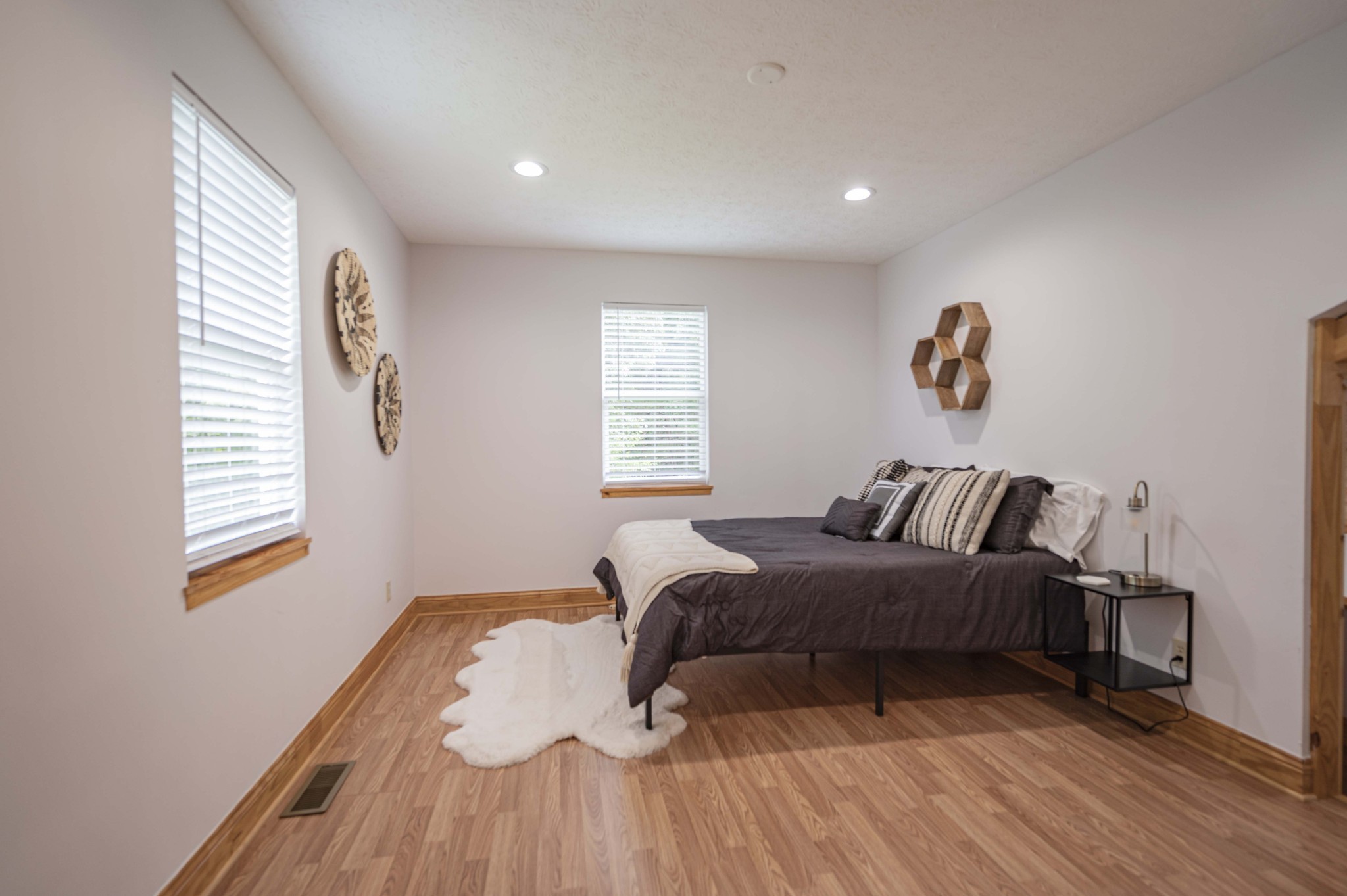 2281 Jefferson Road Smithville, TN 37166 - Photo 21 of 25 a bedroom with a bed and wooden floor