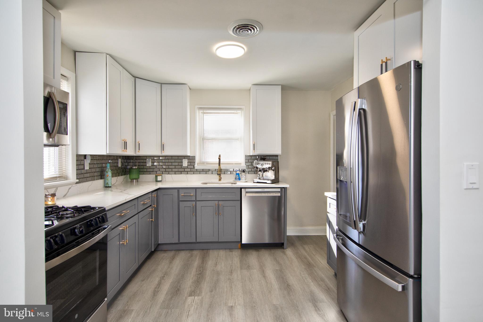 109 Elinor Avenue Nottingham, MD 21236 - Photo 11 of 33 a kitchen with stainless steel appliances granite countertop a refrigerator and a stove