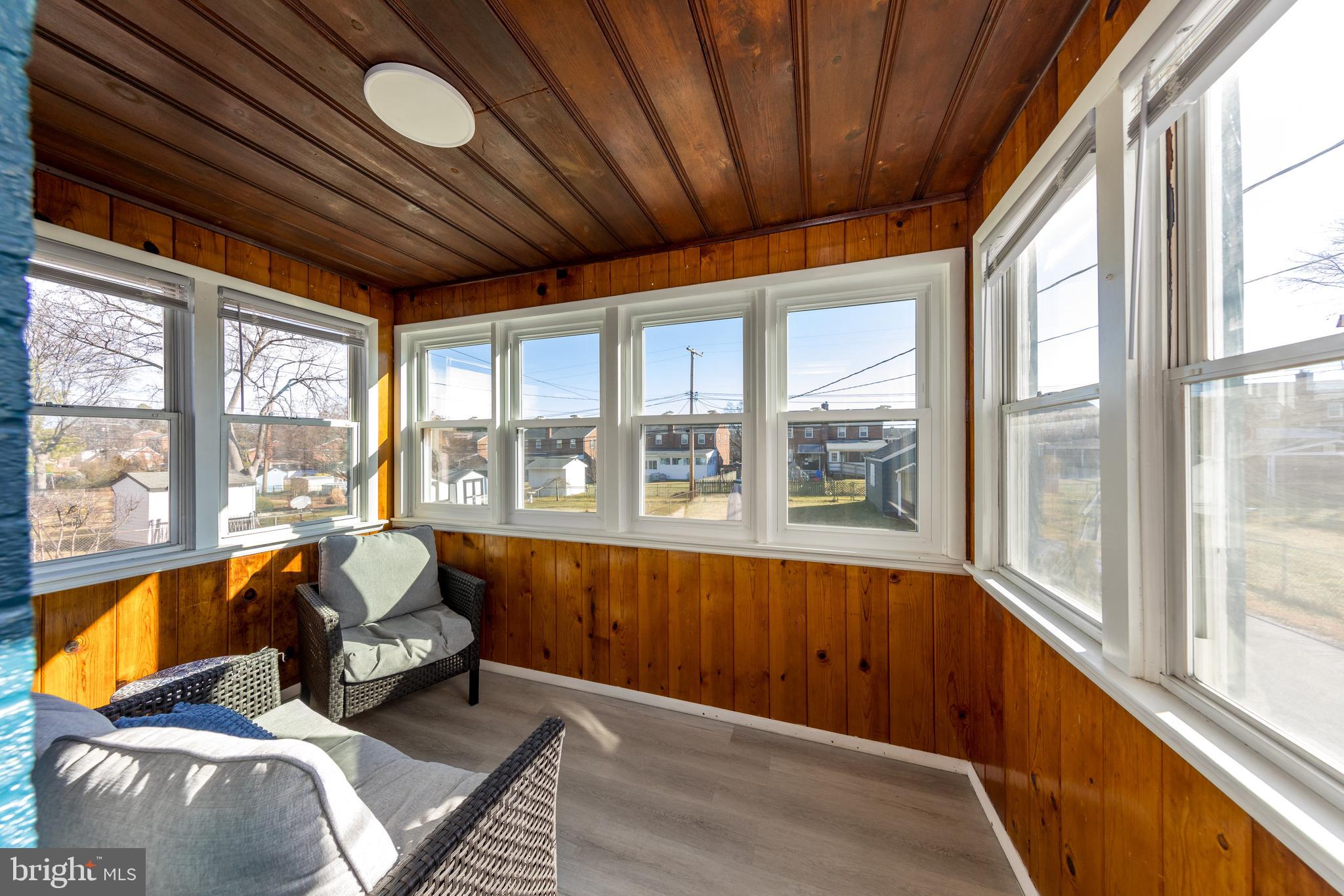 109 Elinor Avenue Nottingham, MD 21236 - Photo 13 of 33 a living room filled with furniture and large windows