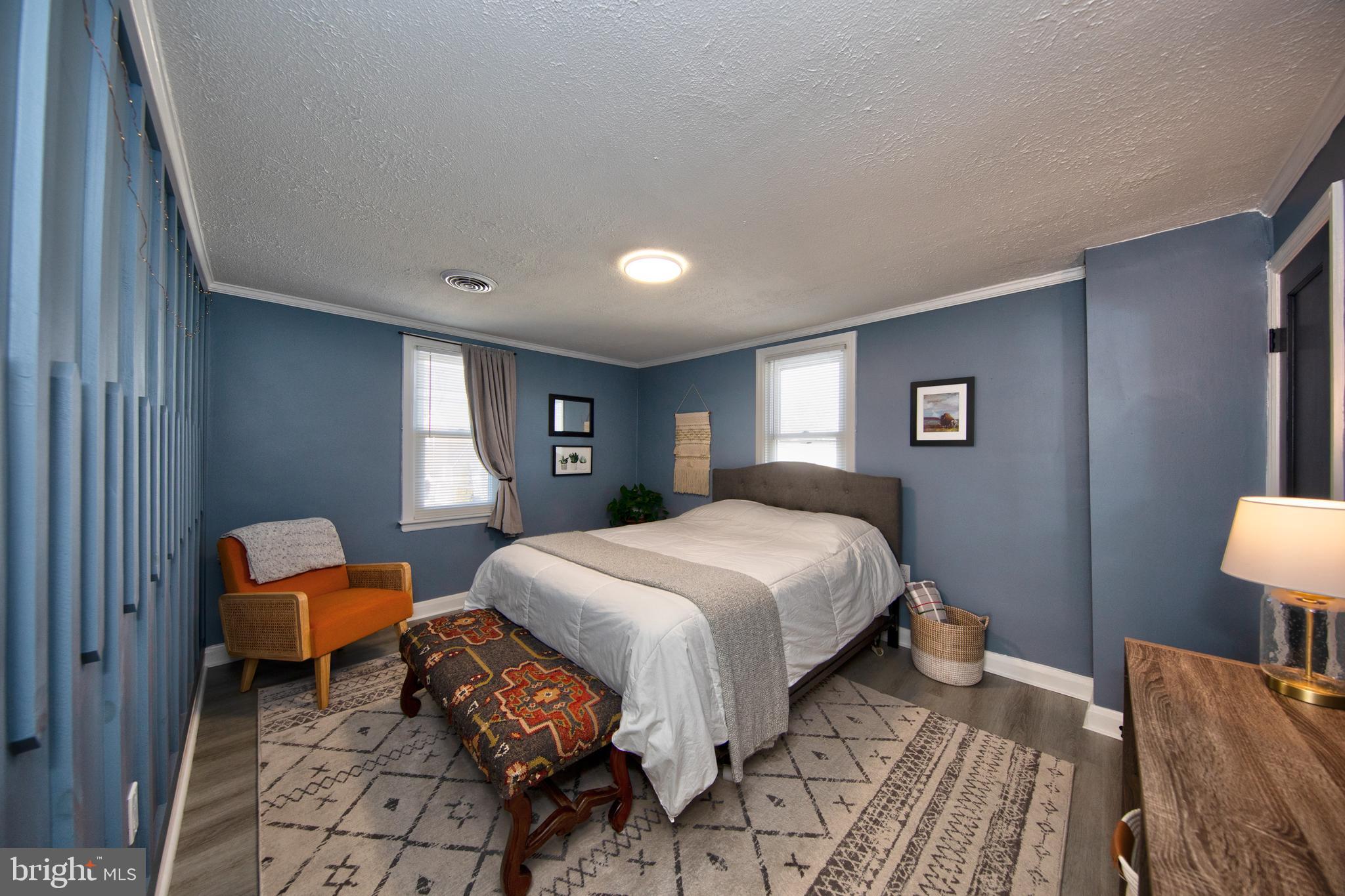 109 Elinor Avenue Nottingham, MD 21236 - Photo 15 of 33 a bedroom with a bed and chair