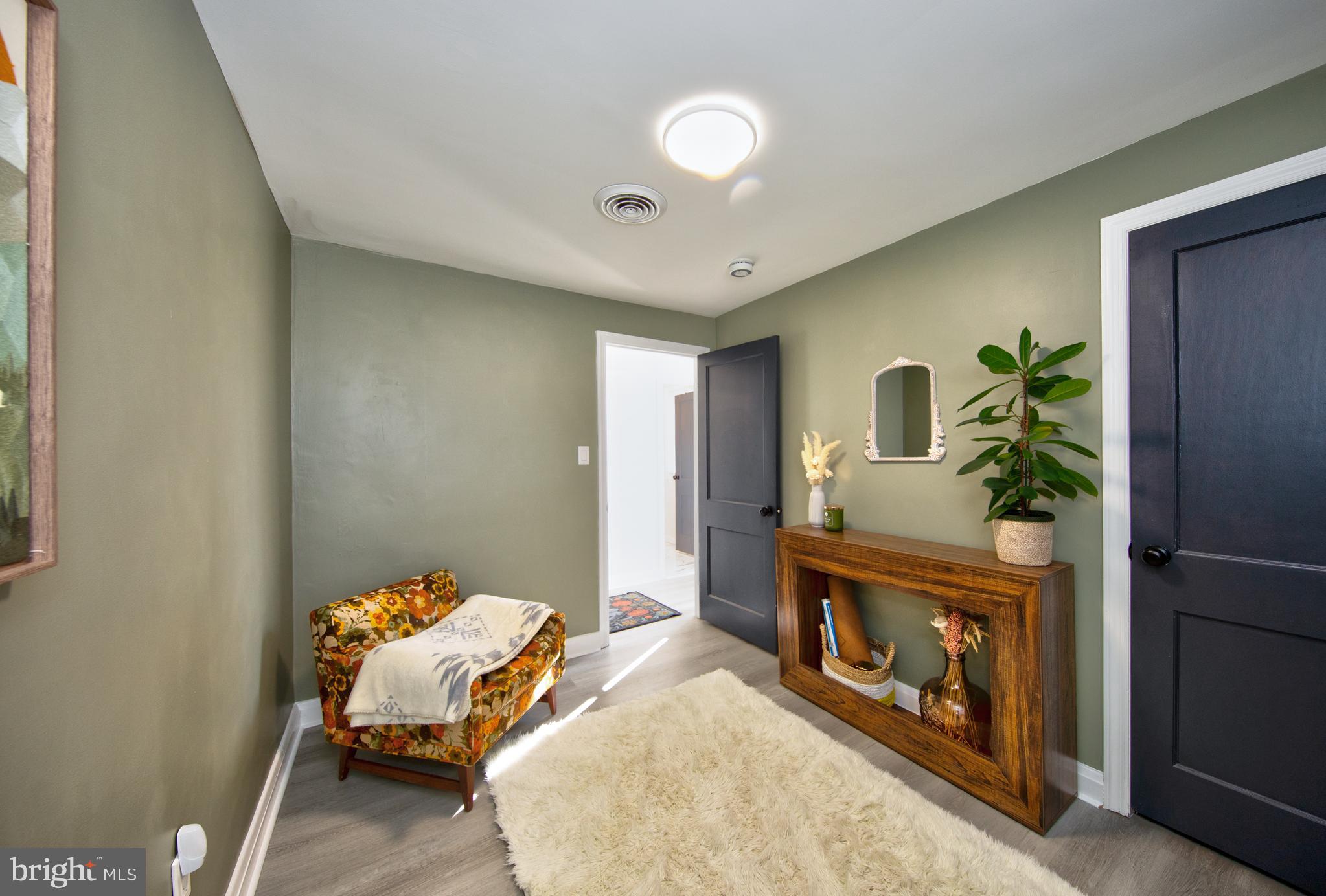 109 Elinor Avenue Nottingham, MD 21236 - Photo 19 of 33 a bedroom with bed and a potted plant