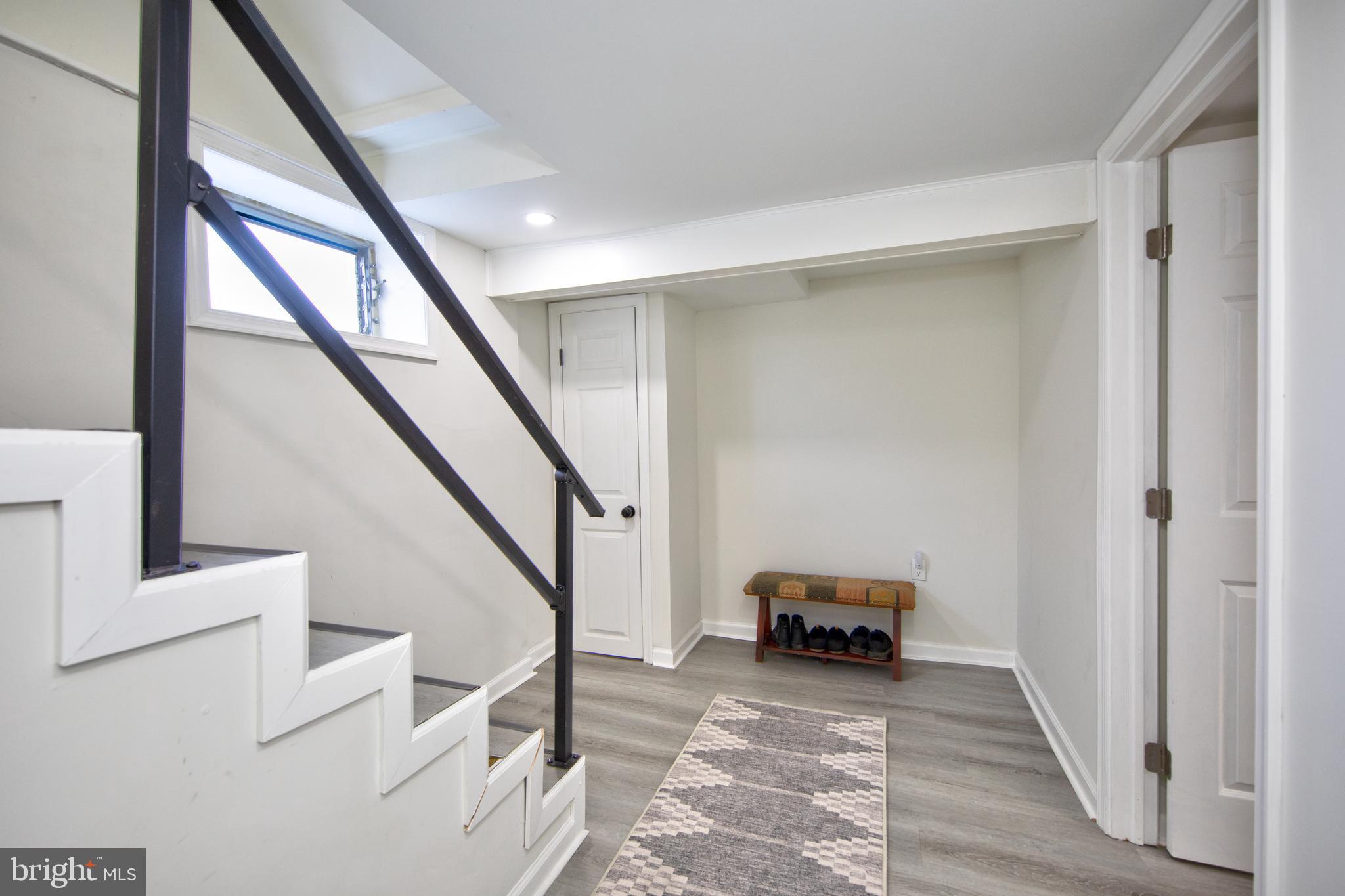 109 Elinor Avenue Nottingham, MD 21236 - Photo 22 of 33 a view of hallway with stairs and wooden floor