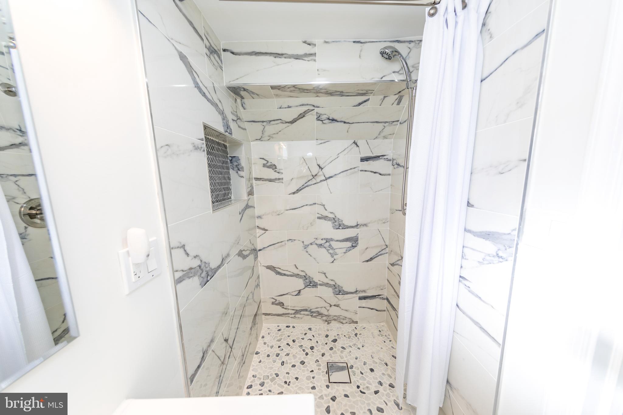 109 Elinor Avenue Nottingham, MD 21236 - Photo 26 of 33 a bathroom with a shower