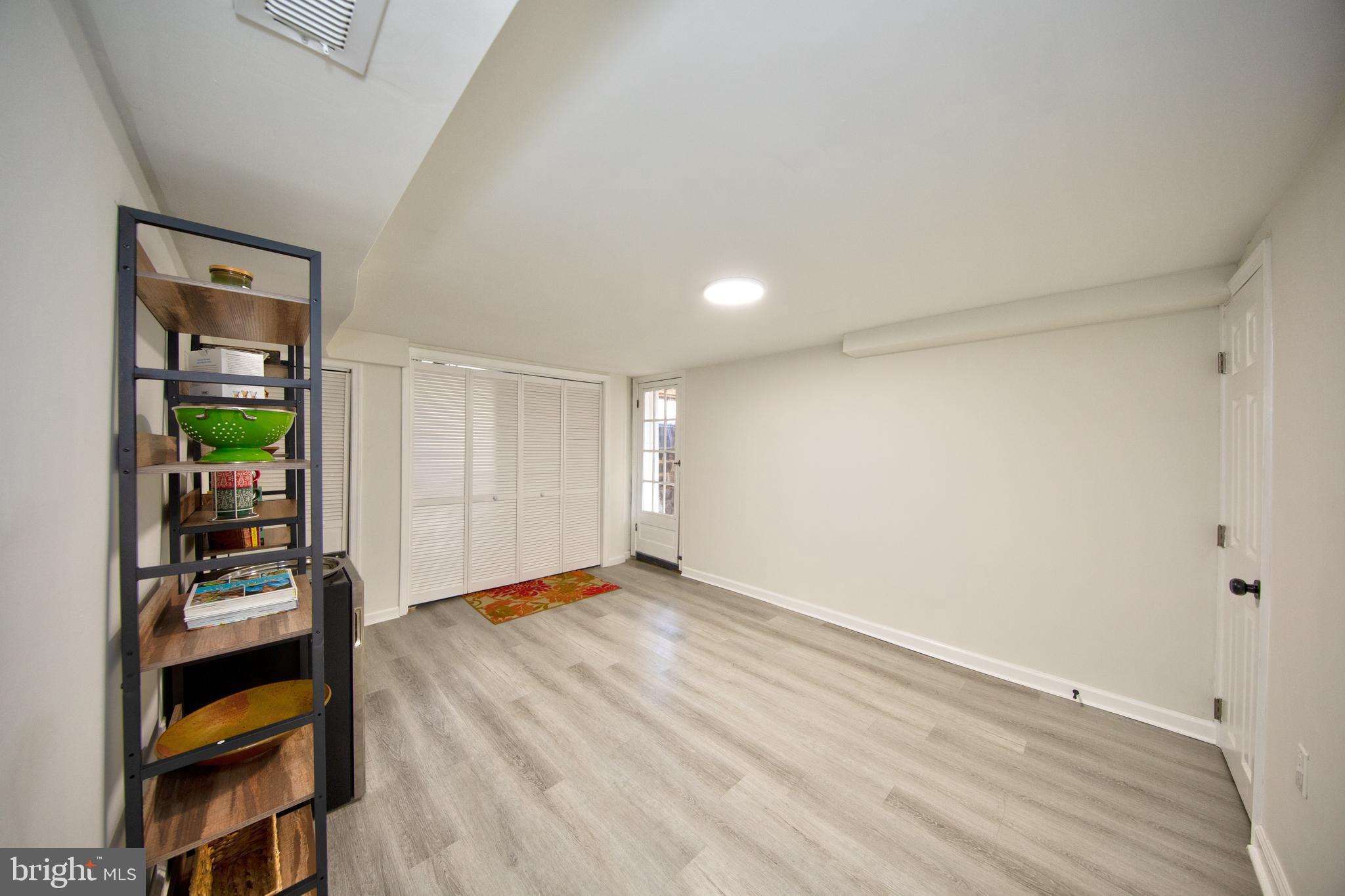 109 Elinor Avenue Nottingham, MD 21236 - Photo 27 of 33 a view of empty room with wooden floor and fan