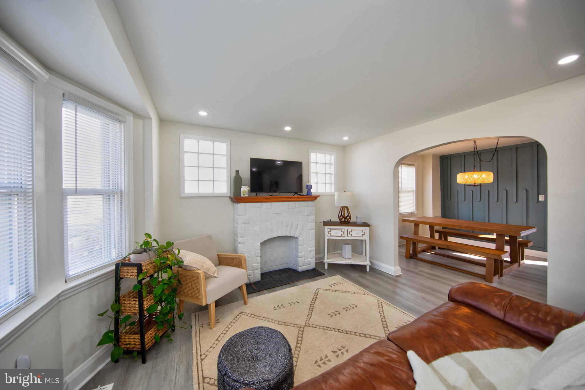 109 Elinor Avenue Nottingham, MD 21236 - Photo 4 of 33 a living room with furniture a window and a flat screen tv