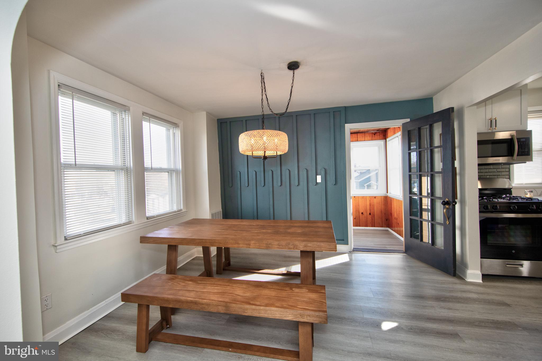 109 Elinor Avenue Nottingham, MD 21236 - Photo 8 of 33 a living room with furniture a flat screen tv and kitchen view