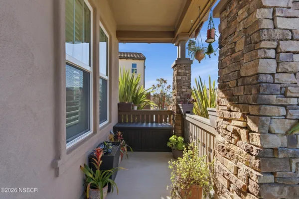 a view of a livingroom with wooden floor and a chair