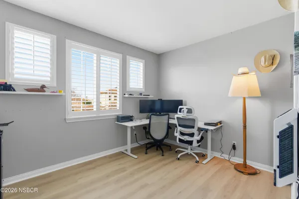 a bathroom with double sink and a mirror
