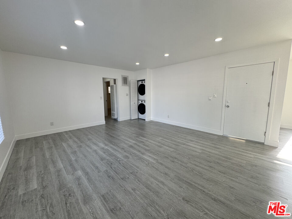1279 North Harper Avenue, Unit 5A West Hollywood, CA 90046 - Photo 5 of 16 a view of an empty room with wooden floor