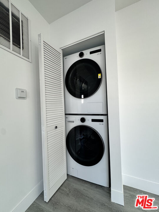 1279 North Harper Avenue, Unit 5A West Hollywood, CA 90046 - Photo 6 of 16 a utility room with dryer and washer