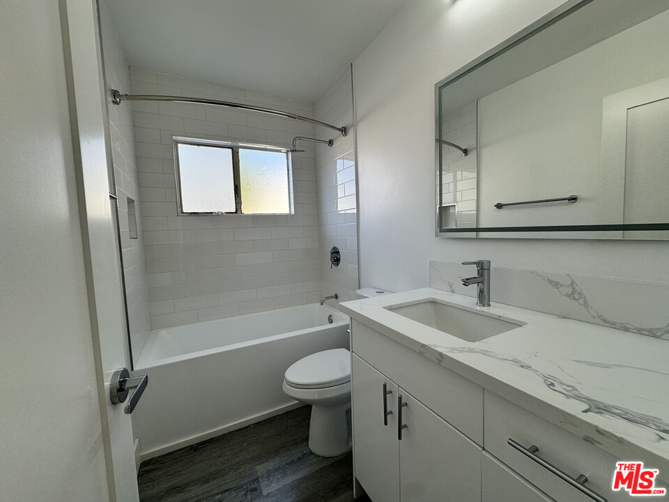 1279 North Harper Avenue, Unit 5A West Hollywood, CA 90046 - Photo 10 of 16 a bathroom with a sink a toilet and shower