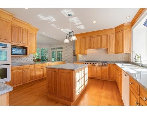 45 Pine Street Weston, MA 02493 - Photo 9 of 27 a kitchen with stainless steel appliances granite countertop a stove a sink dishwasher and a refrigerator