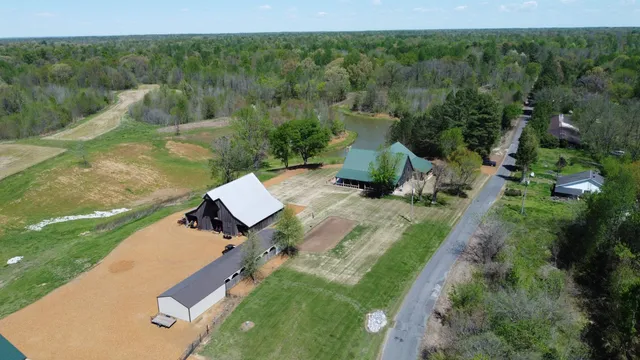an aerial view of a house with a yard