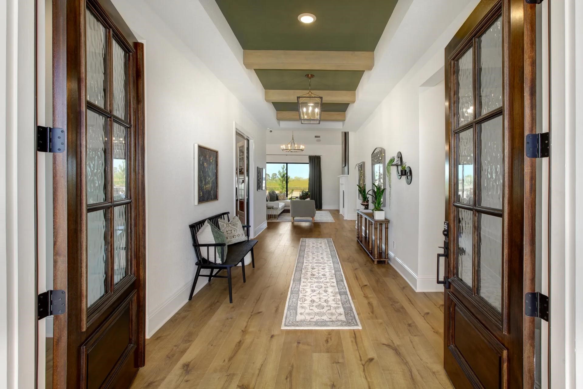 6219 Cavendish Way Manvel, TX 77578 - Photo 5 of 9 a view of a hallway with wooden floor and furniture