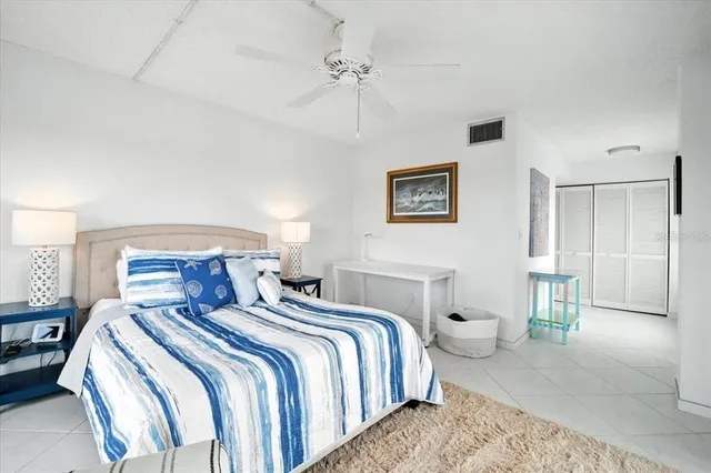 a bathroom with a sink mirror and a toilet