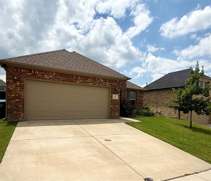 204 Flower Ridge Drive Fort Worth, TX 76108 - Photo 3 of 27 a front view of house with a garden