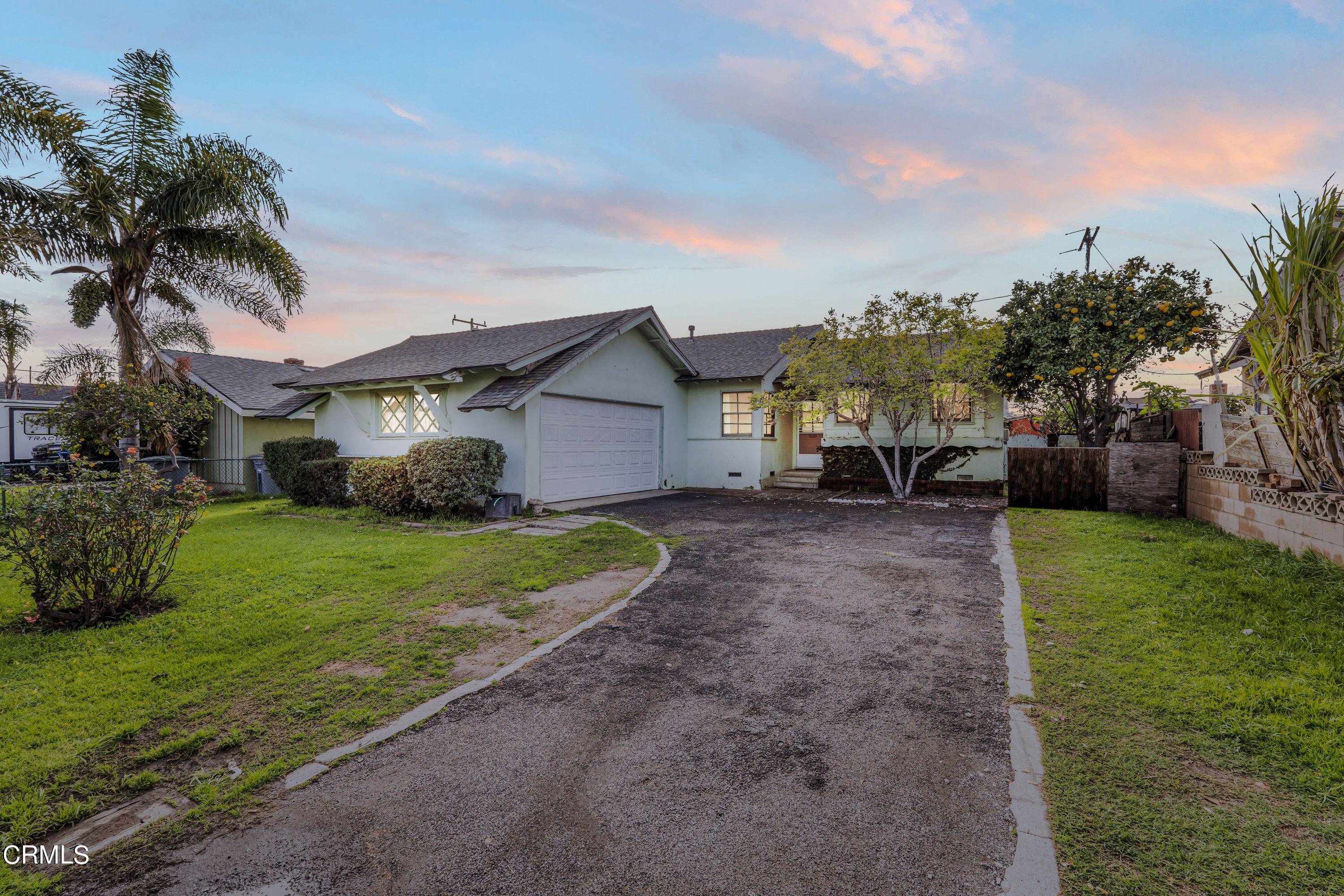 a view of a backyard with a garden