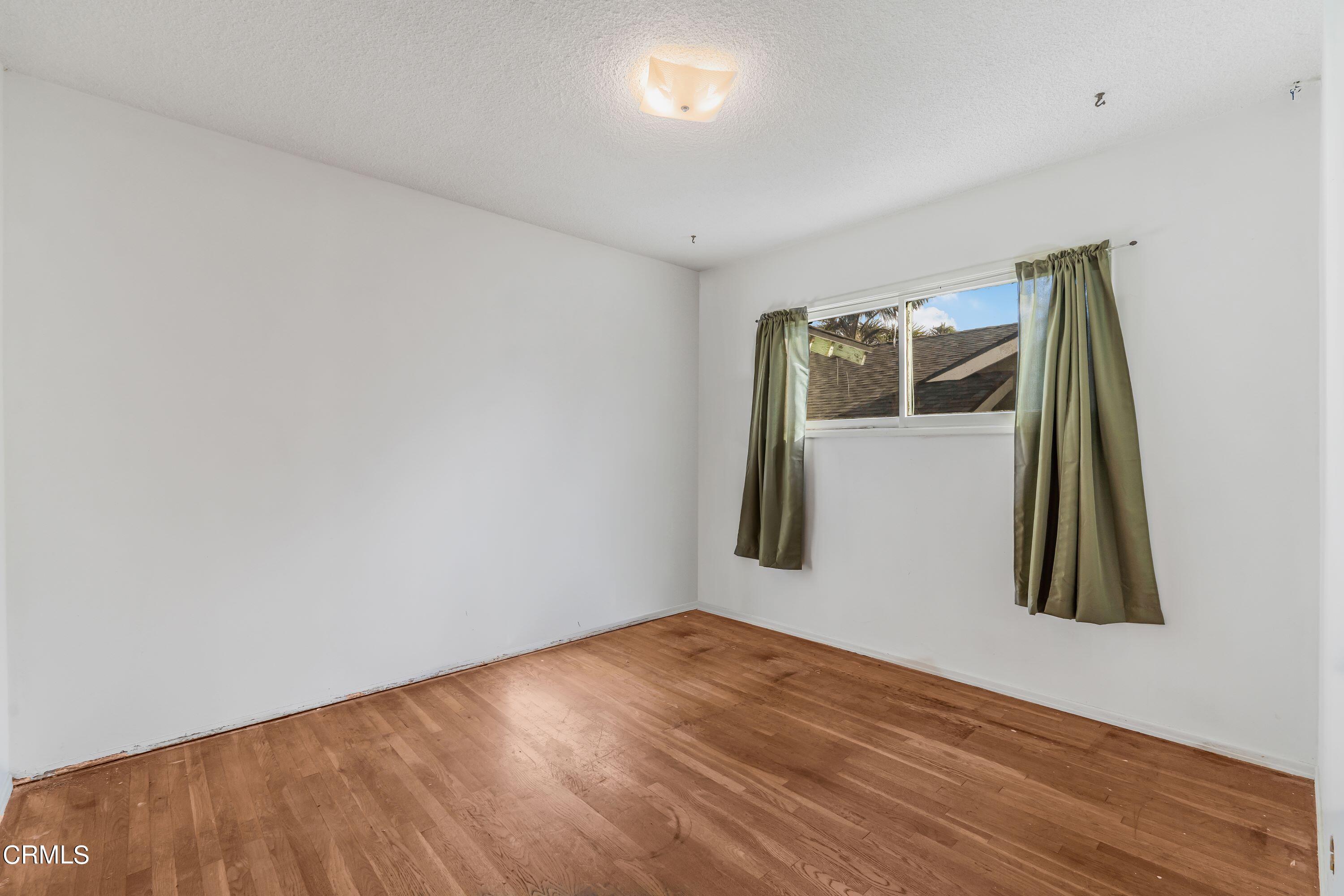 3619 A Court Oxnard, CA 93033 - Photo 12 of 23 a view of a room with wooden floor and bathroom