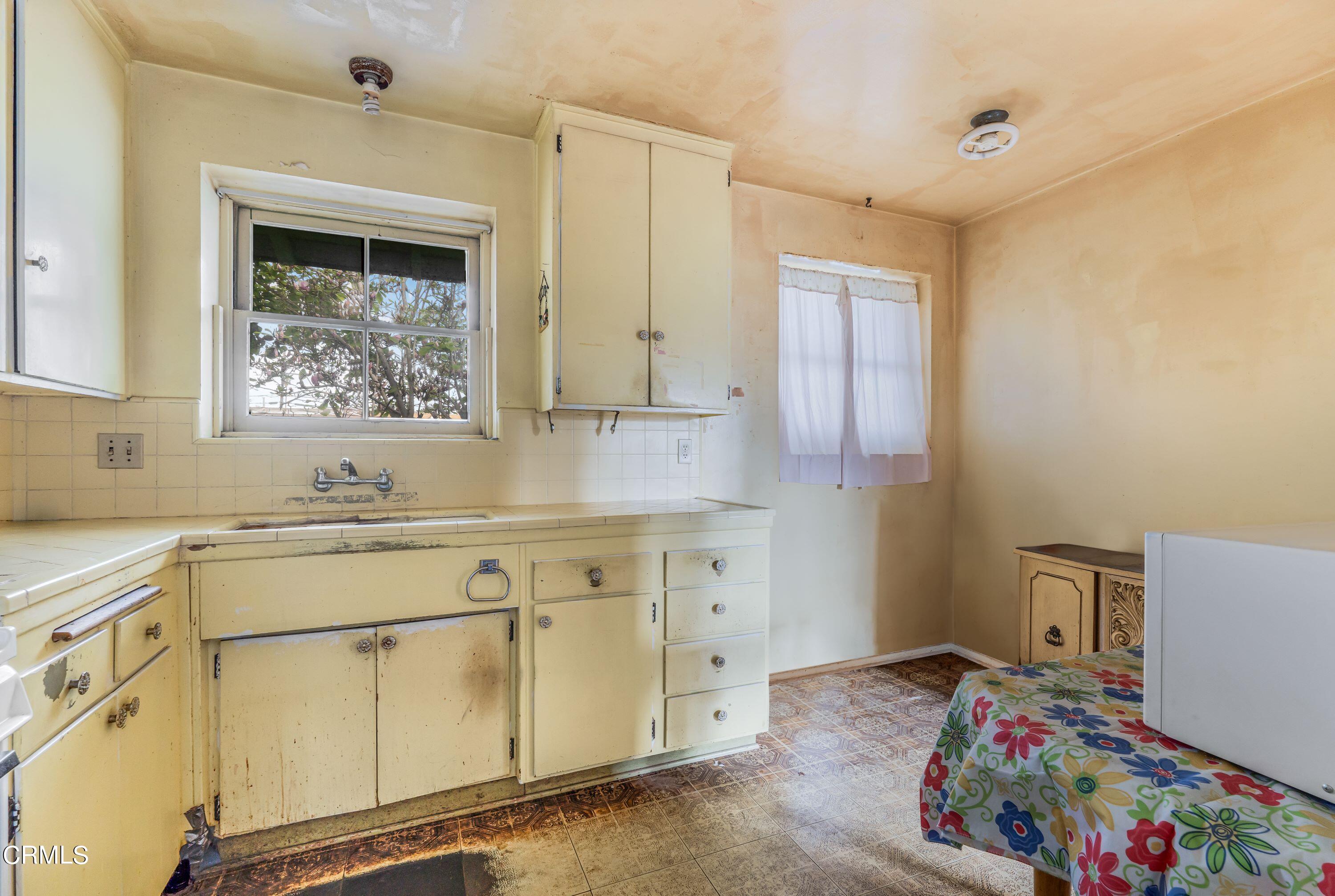 3619 A Court Oxnard, CA 93033 - Photo 8 of 23 a utility room with cabinets washer and dryer