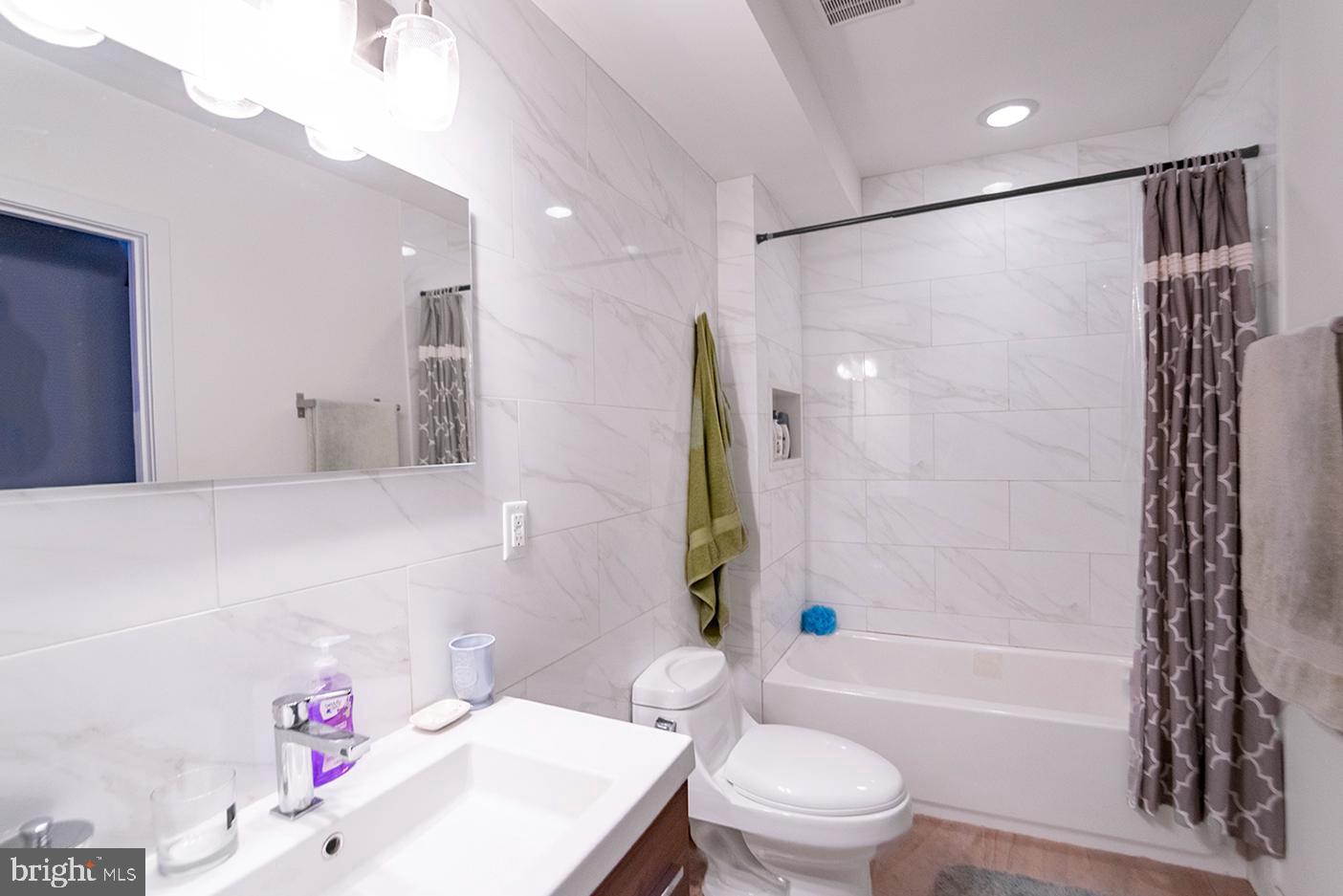 19 North 3rd Street, Unit 4 Philadelphia, PA 19106 - Photo 5 of 10 a bathroom with a sink toilet vanity and shower