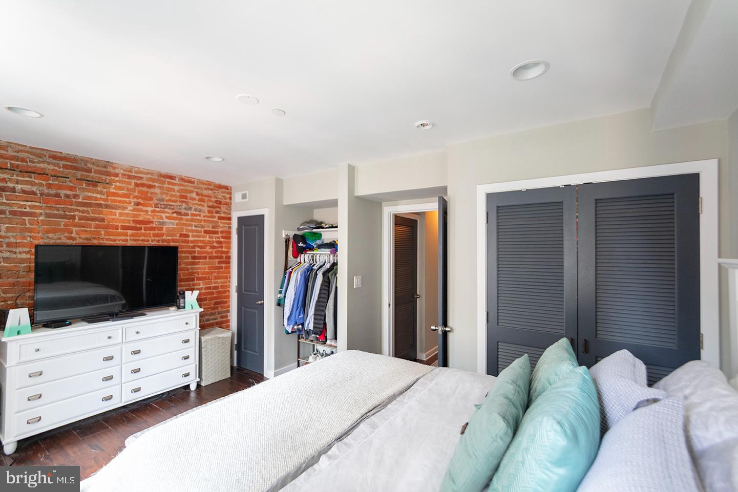 19 North 3rd Street, Unit 4 Philadelphia, PA 19106 - Photo 7 of 10 a living room with furniture and a flat screen tv
