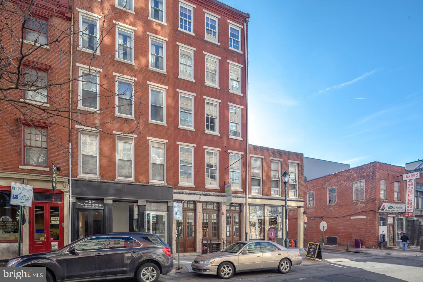 19 North 3rd Street, Unit 4 Philadelphia, PA 19106 - Photo 10 of 10 a front view of a building with lot of cars and trees