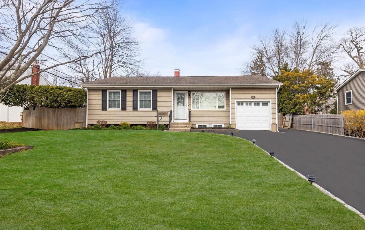 83 Rumford Road Kings Park, NY 11754 - Photo 1 of 1 Grass and driveway have been edited.