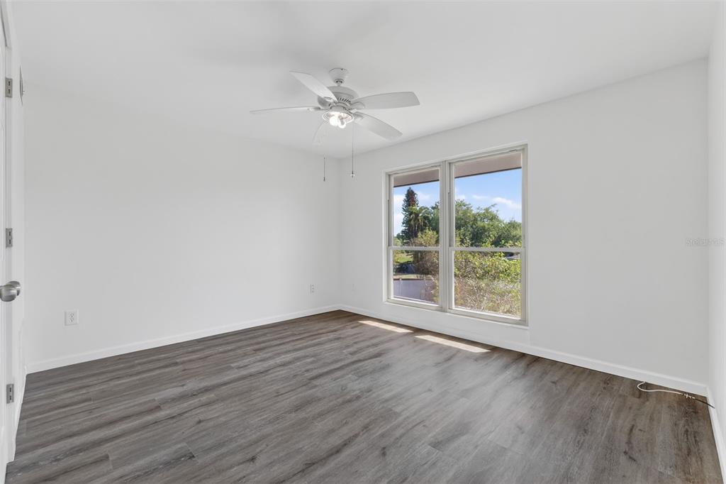 1935 South Conway Road, Unit F6 Orlando, FL 32812 - Photo 12 of 23 a view of an empty room with wooden floor and a window