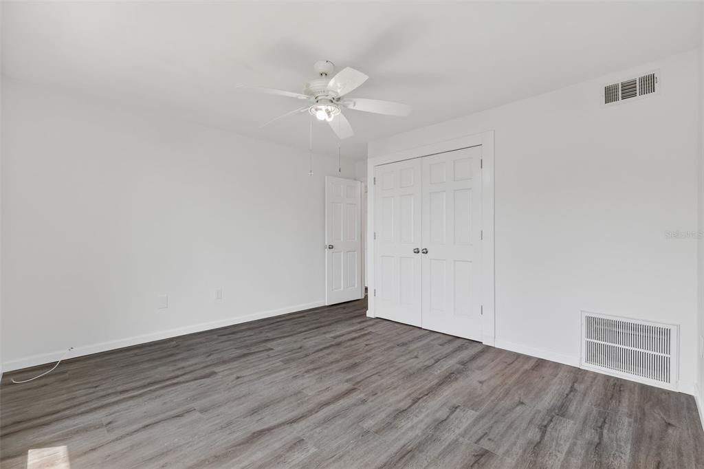 1935 South Conway Road, Unit F6 Orlando, FL 32812 - Photo 13 of 23 a view of an empty room with wooden floor