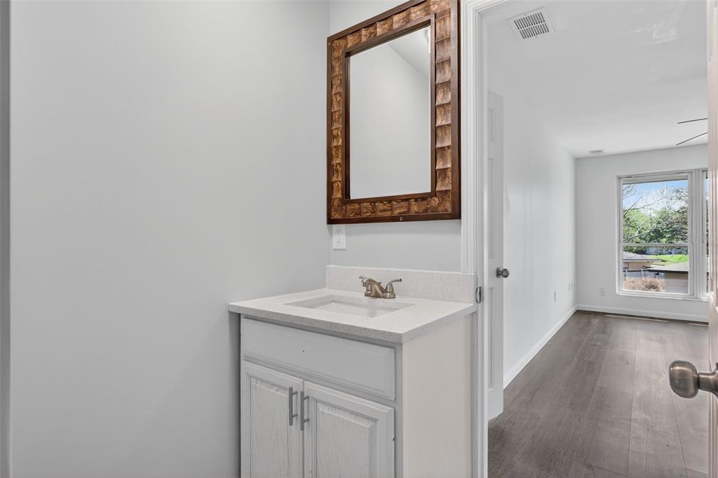 1935 South Conway Road, Unit F6 Orlando, FL 32812 - Photo 14 of 23 a bathroom with a sink and a mirror