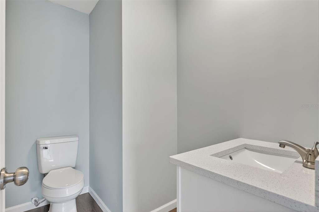 1935 South Conway Road, Unit F6 Orlando, FL 32812 - Photo 15 of 23 a bathroom with a sink mirror and toilet