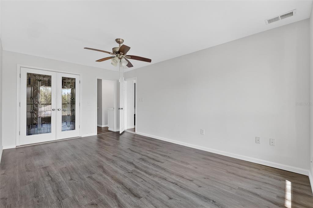 1935 South Conway Road, Unit F6 Orlando, FL 32812 - Photo 16 of 23 wooden floor in an empty room with a window