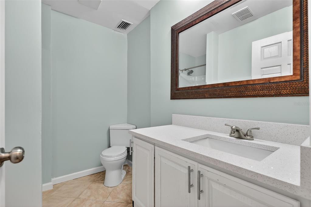 1935 South Conway Road, Unit F6 Orlando, FL 32812 - Photo 18 of 23 a bathroom with a sink toilet and mirror