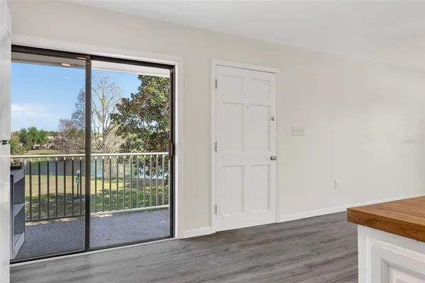 a view of a room with wooden floor and balcony