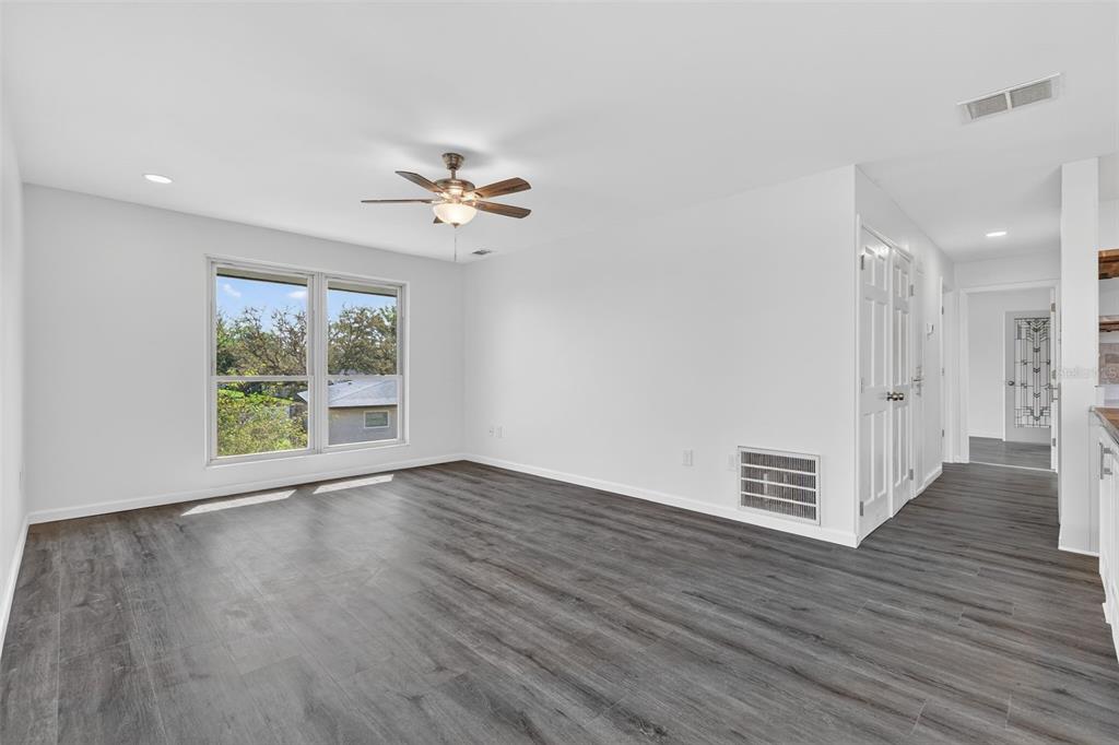 1935 South Conway Road, Unit F6 Orlando, FL 32812 - Photo 9 of 23 a view of an empty room with wooden floor and a window