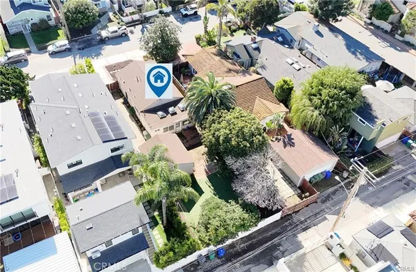 an aerial view of residential house with outdoor space and parking