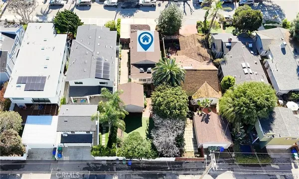 an aerial view of multiple houses with outdoor space
