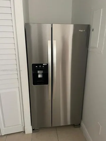 a view of a closet in a kitchen