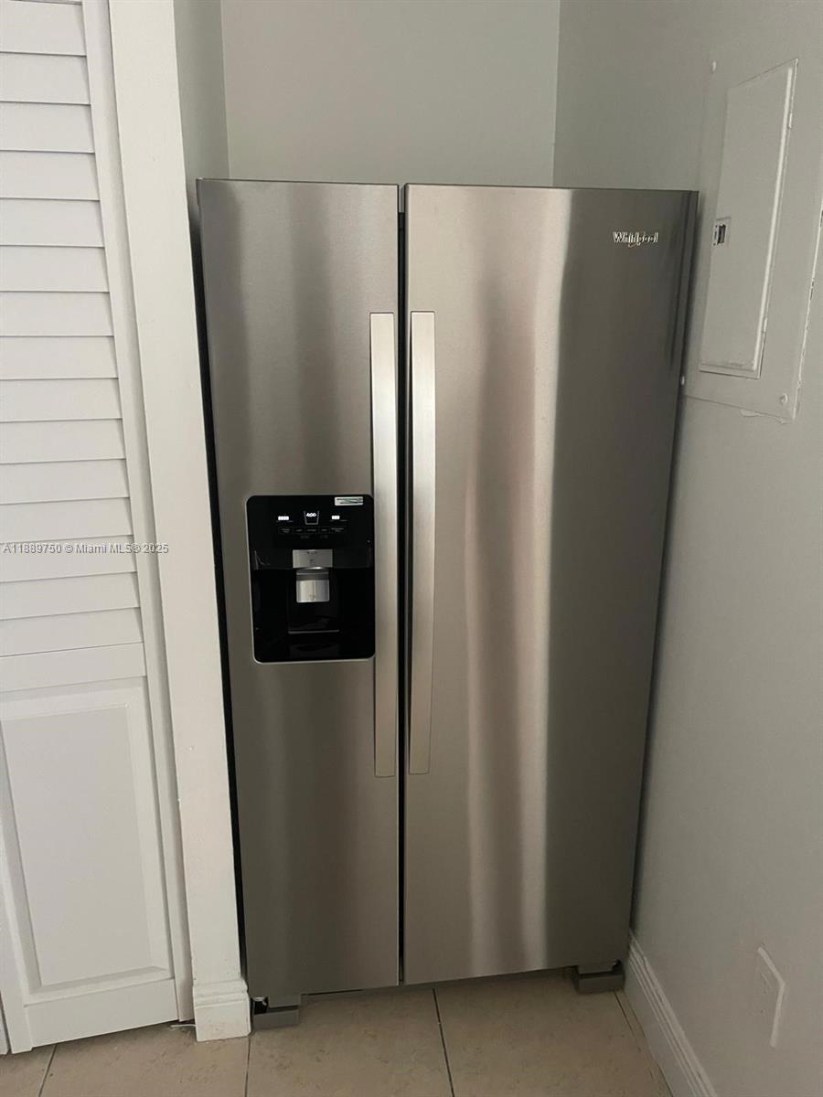 6288 Northwest 186th Street, Unit 201 Hialeah, FL 33015 - Photo 11 of 19 a view of a closet in a kitchen