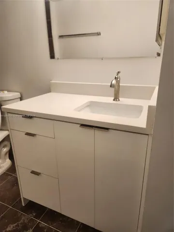 a bathroom with a sink and vanity