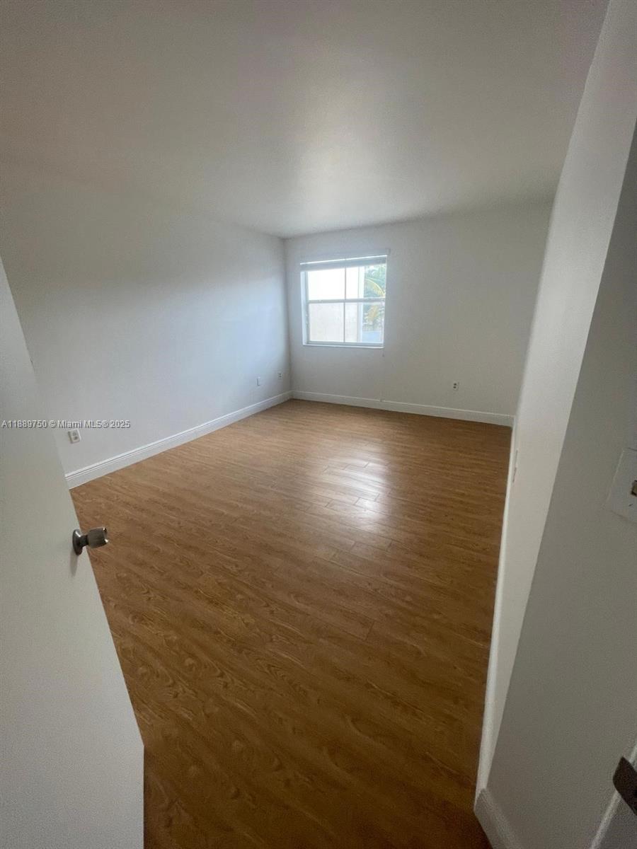 6288 Northwest 186th Street, Unit 201 Hialeah, FL 33015 - Photo 14 of 19 a view of empty room with window