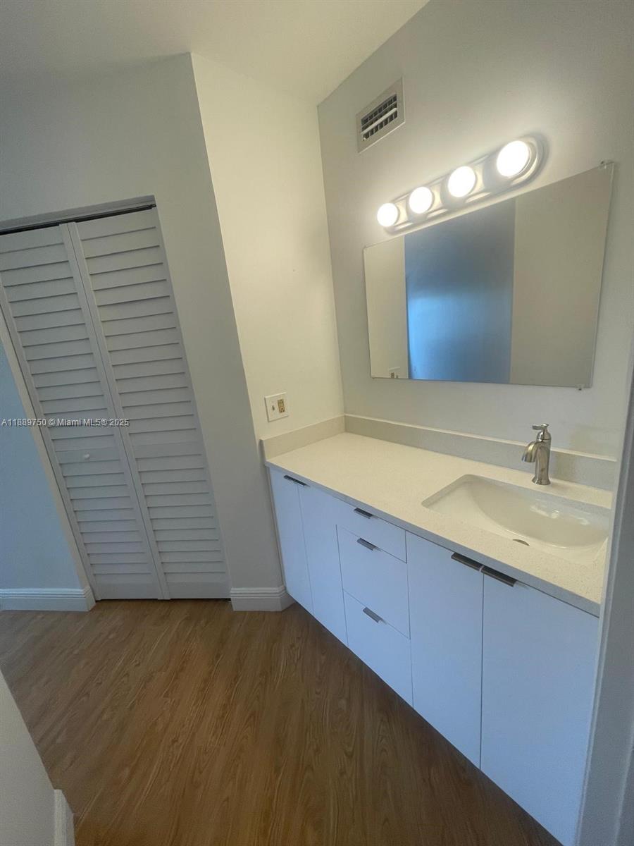 6288 Northwest 186th Street, Unit 201 Hialeah, FL 33015 - Photo 15 of 19 a bathroom with a sink and a mirror
