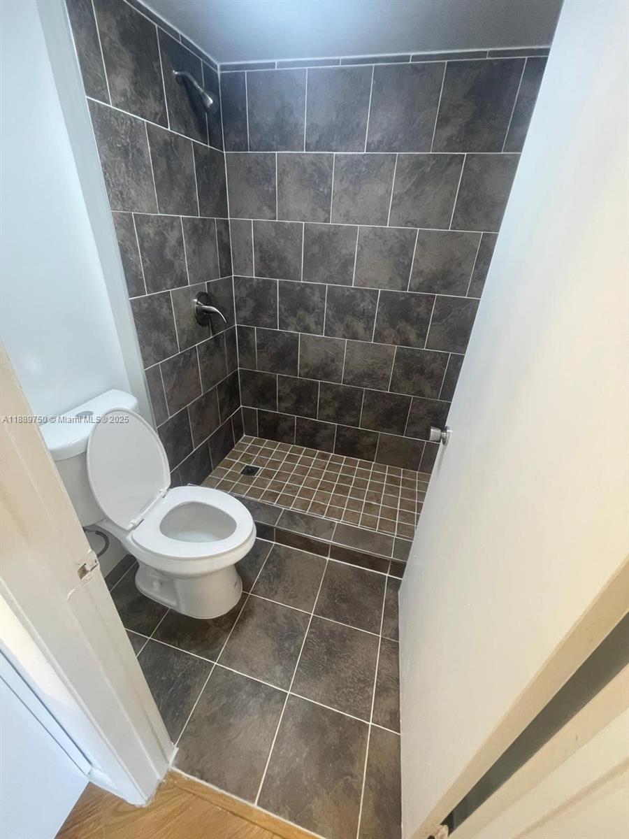 6288 Northwest 186th Street, Unit 201 Hialeah, FL 33015 - Photo 18 of 19 a bathroom with a toilet