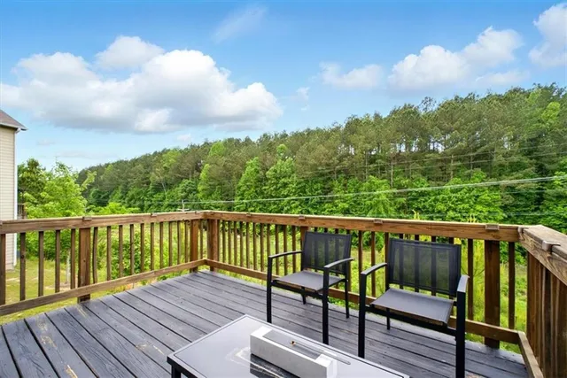 a view of wooden deck with a bench