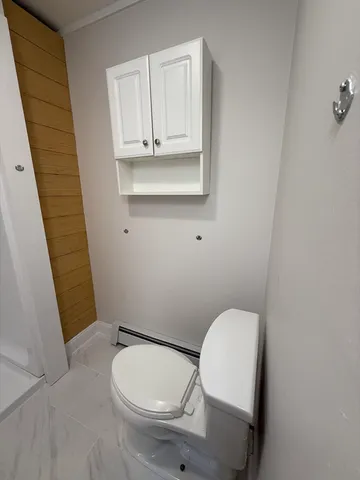 a bathroom with a toilet and a sink