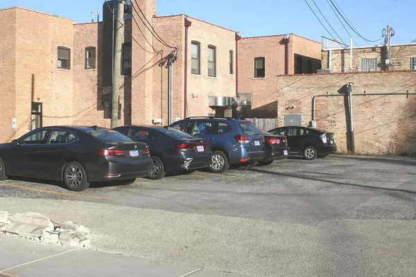 a car parked in front of a house