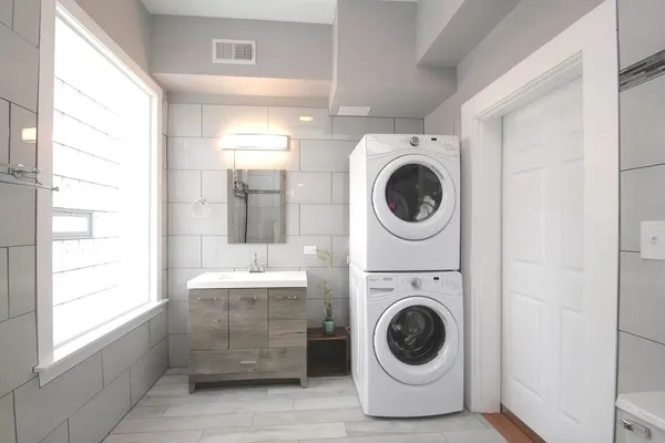 a view of a hallway with washer and dryer
