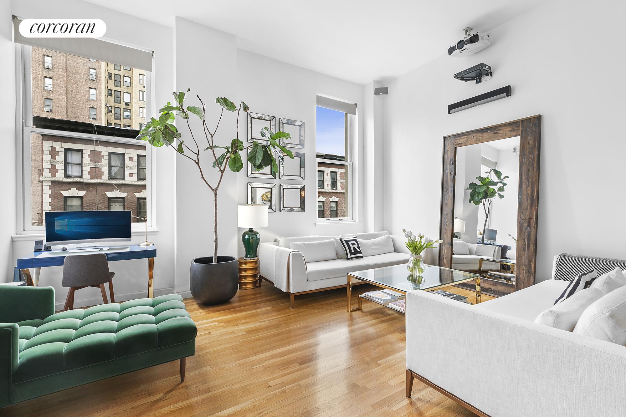 305 2nd Avenue, Unit 319 Manhattan, NY 10003 - Photo 1 of 1 a living room with furniture and a potted plant