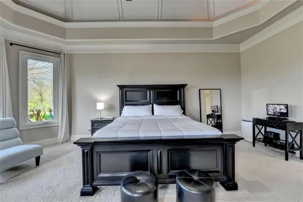 a bed room with a bed and a window